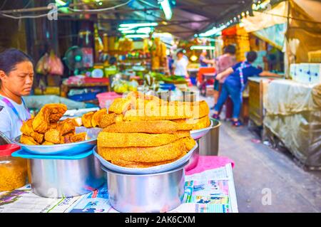 BANGKOK, THAILAND - APRIL 15, 2019: The fried lard on the showcase of the street Sampheng market stall in Chinatown, on April 15 in Bangkok Stock Photo