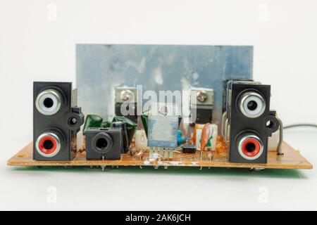 Electronic circuit board of audio amplifier close-up on a white background. Stock Photo
