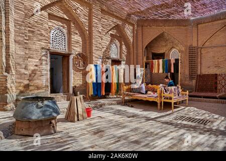 Manufacture of silk carpets in carpet weaving, Itchan-Kala, Khiva, Uzbekistan, Central Asia Stock Photo