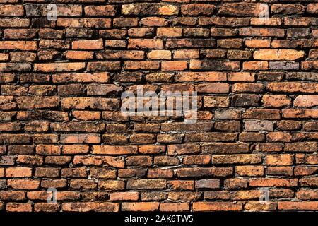 Beautiful orange brick wall that are not plastered background and texture. Stock Photo