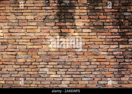 Beautiful orange brick wall that are not plastered background and texture. Stock Photo