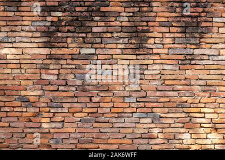 Beautiful orange brick wall that are not plastered background and texture. Stock Photo