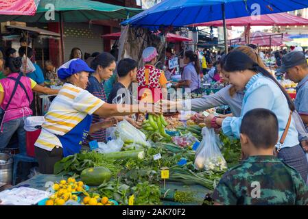 CHIANG RAI, THAILAND - DECEMBER 17, 2018: Trade in the street vegetable market