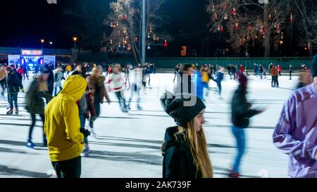 BUDAPEST, HUNGARY - NOVEMBER 30, 2019: View on the people are ice skating in The City Park Ice Rink in Budapest Stock Photo