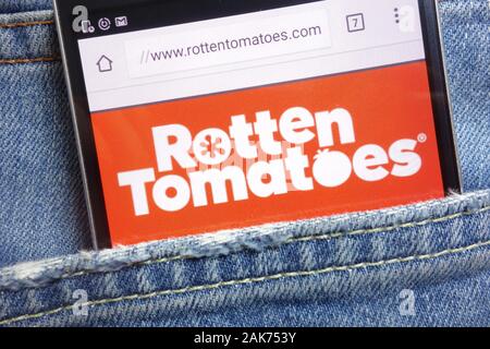 Rotten Tomatoes website displayed on smartphone hidden in jeans pocket Stock Photo