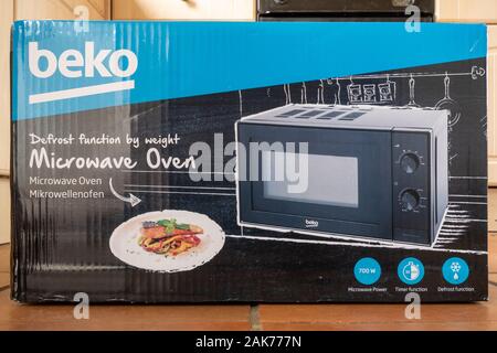 New Beko microwave oven in cardboard box packaging Stock Photo