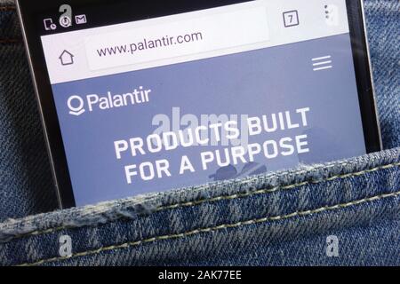 Palantir Technologies website displayed on smartphone   hidden in jeans pocket Stock Photo