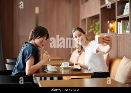 Young girlfriends at a cafe Stock Photo