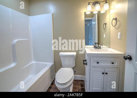 Horizontal shot of a bathroom in a new small starter home. Stock Photo