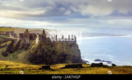 Ruined medieval Dunluce Castle on the cliff in Bushmills, Northern Ireland. Filming location of popular TV series, Game of Thrones, Castle Greyjoy Stock Photo