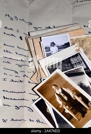 Old black and white photographs on an old 1940's handwritten letter Stock Photo