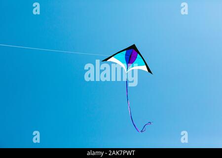 Kite flying high in the sky Stock Photo