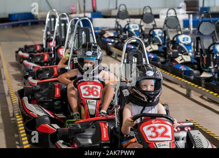 Mackay, Queensland, Australia - January 2020: Children line up in their go-karts at the start of a fun recreational drive around a circuit in public Stock Photo