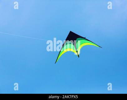 Kite flying high in the sky Stock Photo