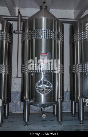 Stainless steel storage tanks for wine production at Aurora Winery in Bento Goncalves. A wine producing country city in southern Brazil. Stock Photo