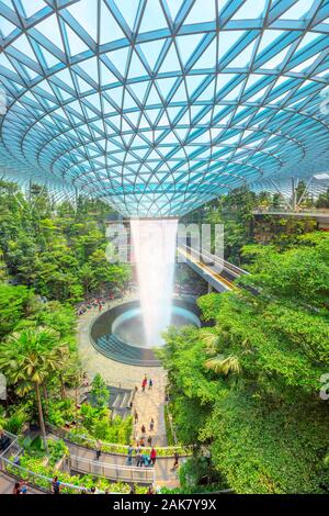 Singapore - Aug 8, 2019: aerial view from Canopy Park of Rain Vortex, the world's largest indoor waterfall surrounded by a four-story terraced forest Stock Photo