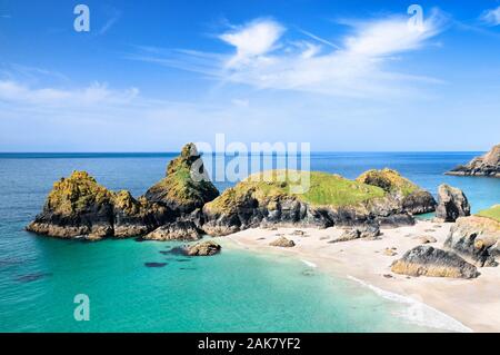 Kynance Cove on the Lizard Peninsula with its distinctive serpentine rock stacks, white sands and turquoise blue waters, Cornwall, England, UK Stock Photo
