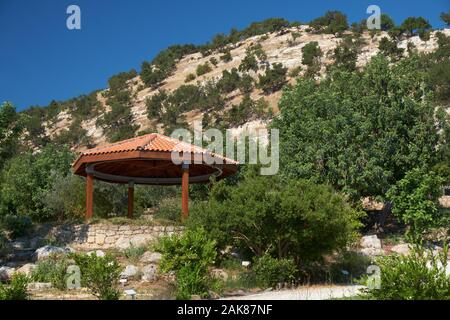 LATCHI, CYPRUS - JUNE 07, 2018: The view of pavilion in the Botanical garden with Baths of Aphrodite  near village of Latchi on Akamas Peninsula.  Cyp Stock Photo