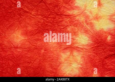 red, yellow decorative packing paper crumpled and wrinkled Stock Photo