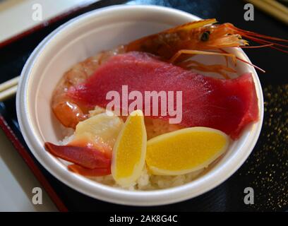 Sashimi Donburi, Japanese seafood rice bowl topped with mixed raw fish and shrimp. Stock Photo