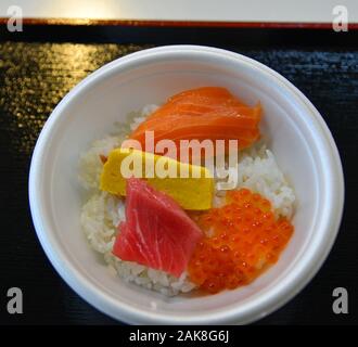 Sashimi Donburi, Japanese seafood rice bowl topped with mixed raw fish and shrimp. Stock Photo