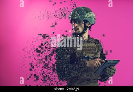 soldier using tablet computer hands closeup pnk background Stock Photo