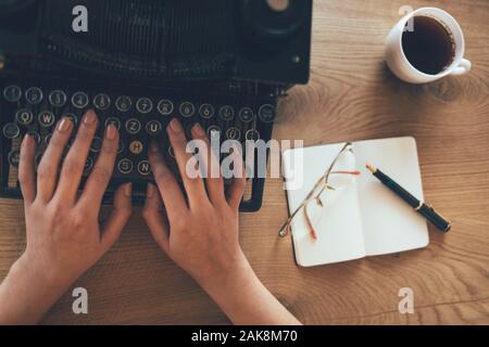 Close up of business woman hand working on office desk Stock Photo