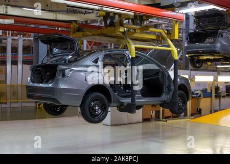 Russia, Izhevsk - December 14, 2019: LADA Automobile Plant Izhevsk. The bodies of new cars on the conveyor line. Assembly shop of  automobile plant.