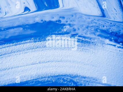 Abstract classic blue color painting background made in fluid art technique. 2020 color trend pattern. Stock Photo
