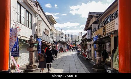 Fushimi Inari-taisha Shrine. Thousands countless vermilion Torii gates on a hill Stock Photo