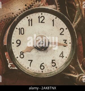Close up of an ancient weathered clock device with gears Stock Photo