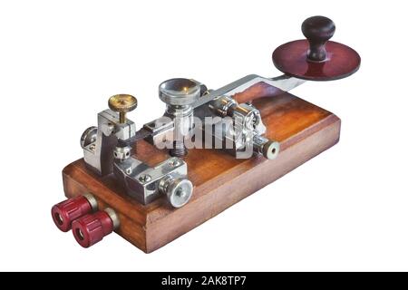 Ancient morse code telegraphy device isolated on a white background Stock Photo