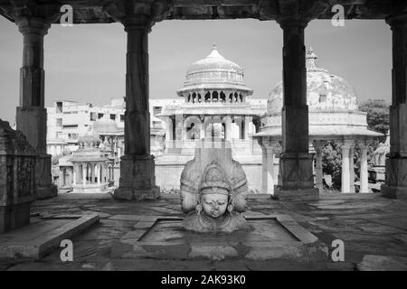 Sculpture of Hindu tripartite Gods under Royal cenotaph and surrounded by many cenotaphs in Udaipur, Rajasthan, India. Stock Photo