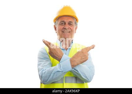 Old builder man with trustworthy smile holding hands and fingers crossed as good luck hopeful concept isolated on white Stock Photo