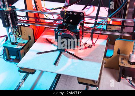 Electronic three dimensional plastic printer during work in school laboratory, 3D printer, 3D printing. Stock Photo
