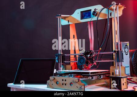 Electronic three dimensional plastic printer during work in school laboratory, 3D printer, 3D printing. Stock Photo