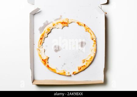 Left corner of a Pizza in a cardboard box Stock Photo