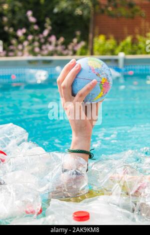UFA, RUSSIA - JULY 25, 2019 : Problem of trash, plastic recycling, pollution and environmental concept - Plastic rubbish pollution in water environmen Stock Photo