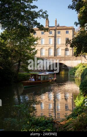 BATH, UK - OCTOBER 2, 2011: Tourists on a boat trip along the Kennet and Avon canal pass by the historic Cleveland House, once the headquarters of the Stock Photo