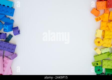 Plastick constructor cubes on white background. Popular toys. Stock Photo