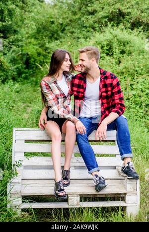 Romantic couple sitting near campfire kissing and showing heart shaped  gesture Stock Photo - Alamy