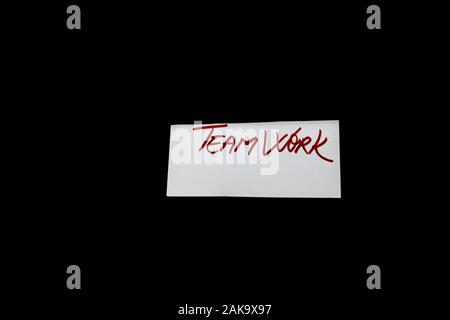 Text Teamwork on white label isolated on black background. Stock Photo