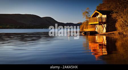 Duke of Portland boathouse on Lake Ullswater in the Lake District national park in Cumbria on a calm morning in Autumn Stock Photo