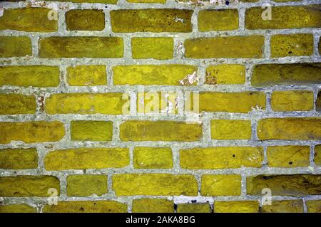 Old brick wall of yellow brick. Texture, background Stock Photo