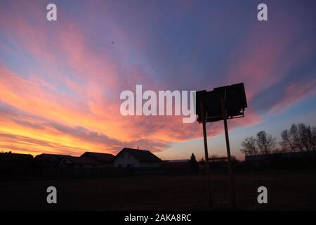beautifully painted incredible sky above the village Stock Photo