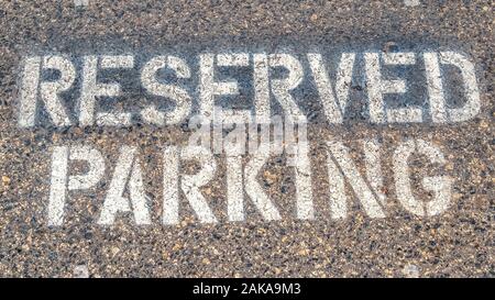 Panorama Reserved Parking sign stencilled on tarmac close up Stock Photo