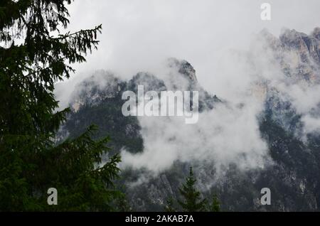 After the rain clouds of steam envelop the mountain peaks Stock Photo