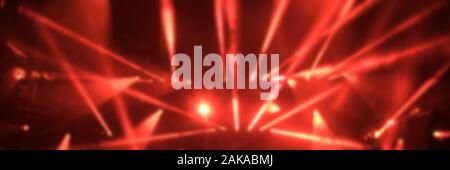 Red music concert lights, blurred panoramic background Stock Photo