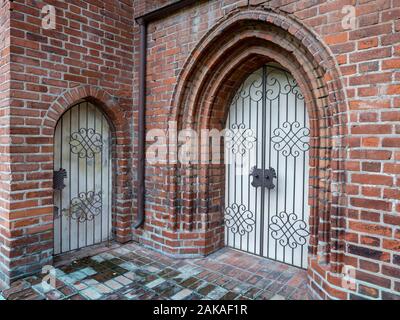 gothic doors in the brick wall Stock Photo