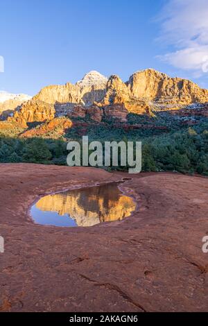Sunset light hitting red rock formations in Sedona Arizona. Stock Photo